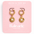 Gold hoop earrings on a pink card with 'Ibiza & The UK' branding.