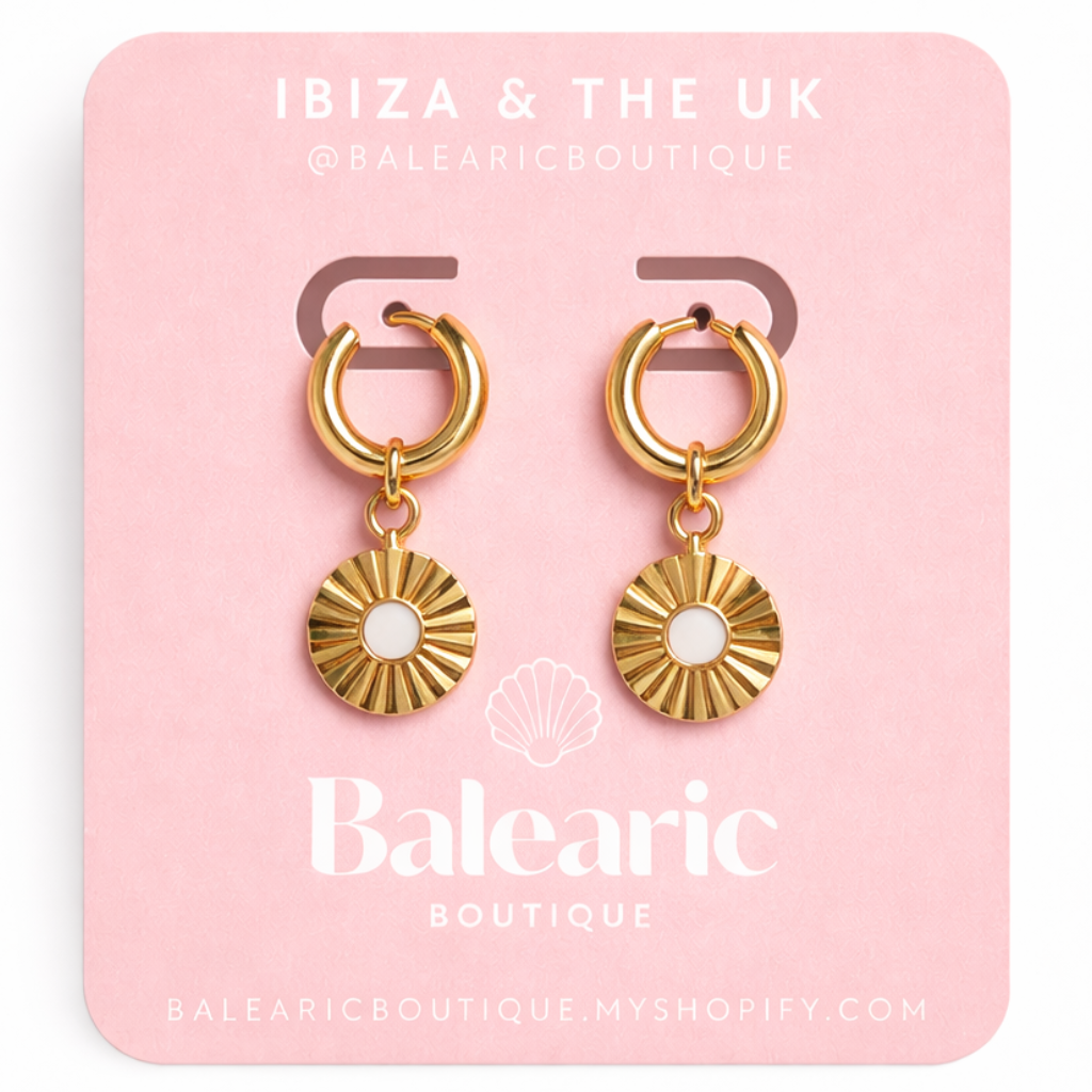 Gold hoop earrings on a pink card with 'Ibiza & The UK' branding.