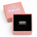 Silver ring in a pink box with 'Balcaric Boutique' branding on a white background