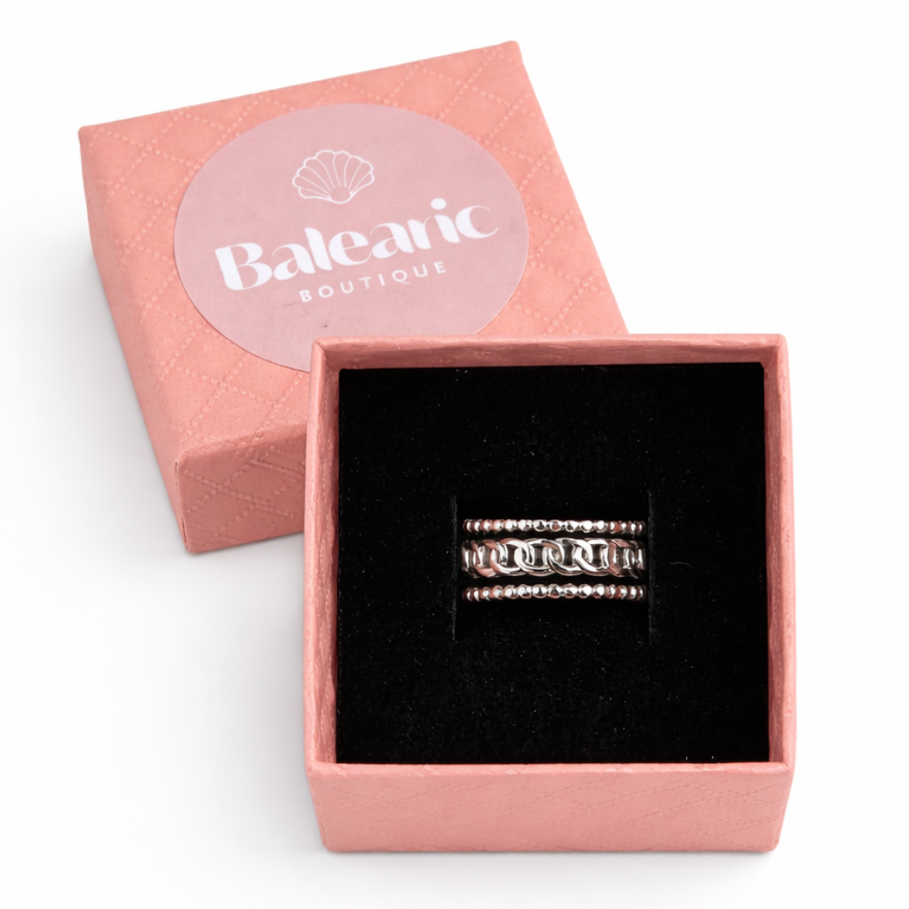 Silver ring in a pink box with 'Balcaric Boutique' branding on a white background