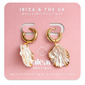 Shell-shaped earrings on a pink card with 'Ibiza & The UK' branding.