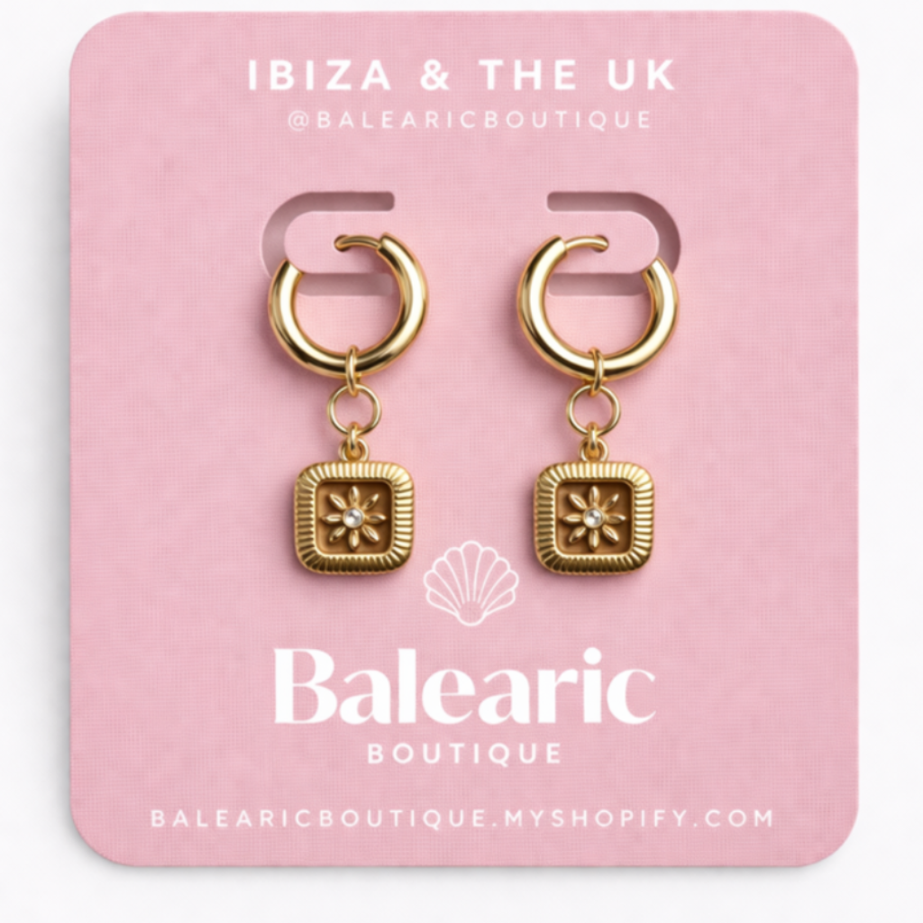 Gold earrings on a pink card with 'Balcaric' branding