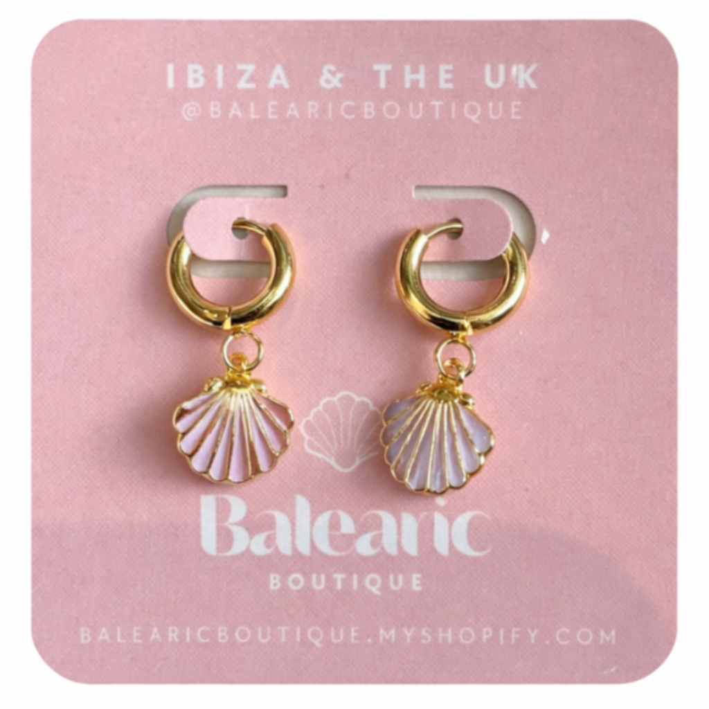 Pair of gold hoop earrings with shell charms on a pink card labeled 'Baleanic'.